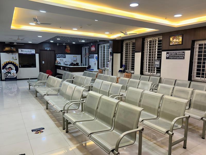Spacious patient waiting lounge with laboratory sample collection centre at Mahalakshmi Multispeciality Hospital, Shivamogga